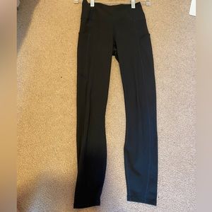 Dark Green Fabletics leggings with pockets.
